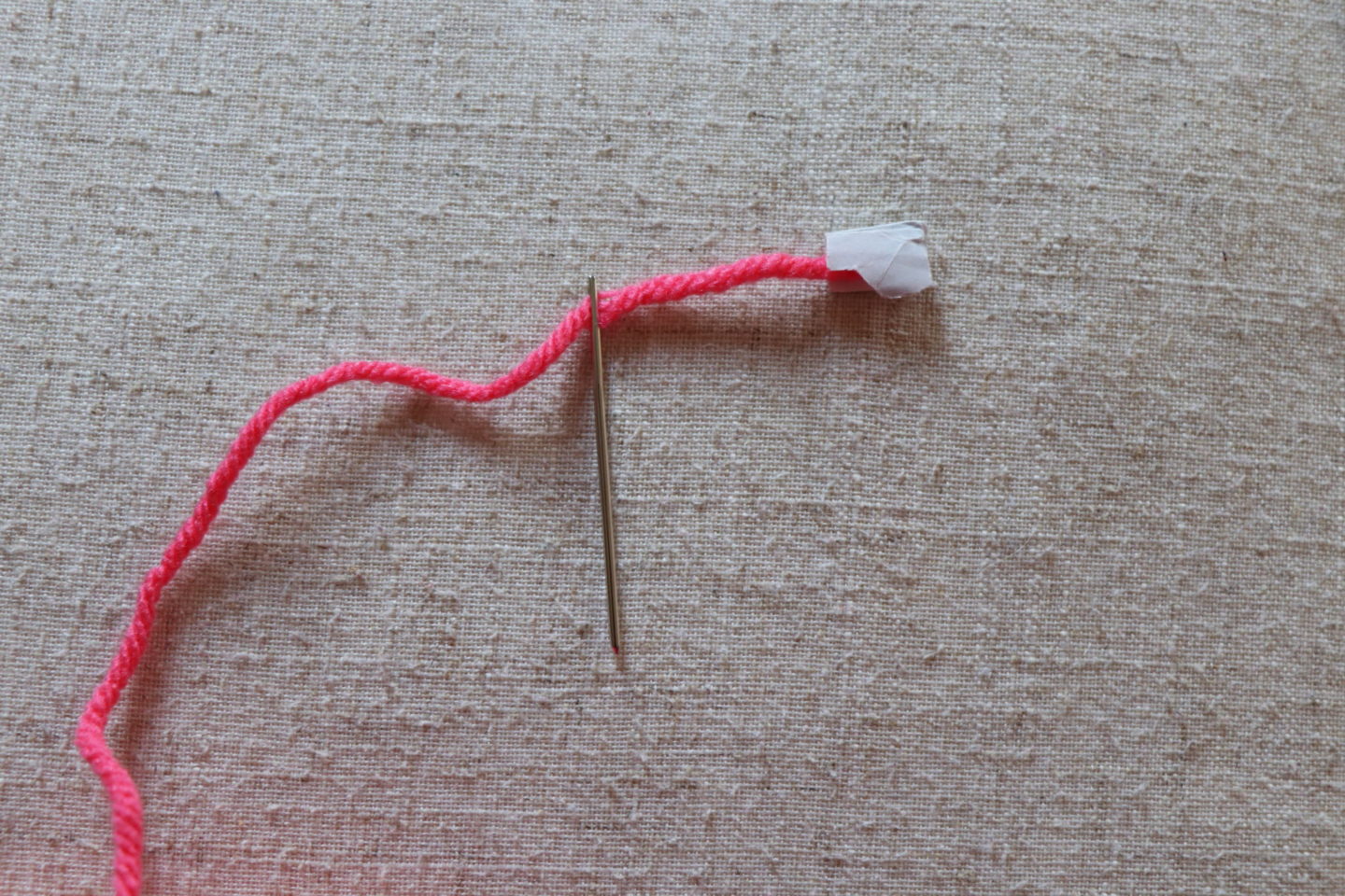 How to weave in ends. THE BEST TIP: use paper to hold the yarn. Look how easy that is!