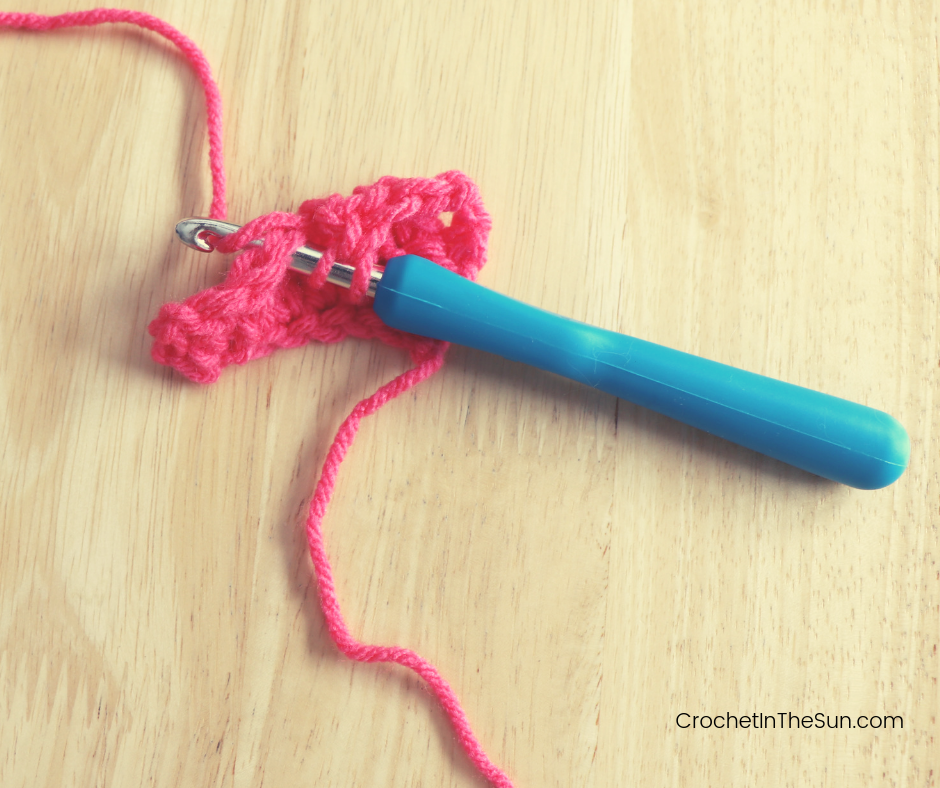 Step 4 of completing the Double crochet stitch: Yarn over again. You don't need to insert your hook, just y/o as it is.