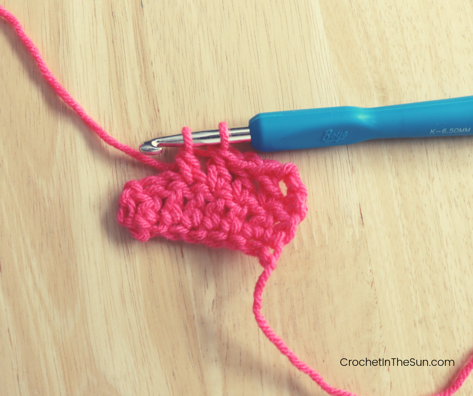 Step 6 of completing the Double crochet stitch: Pull through 2 stitches.