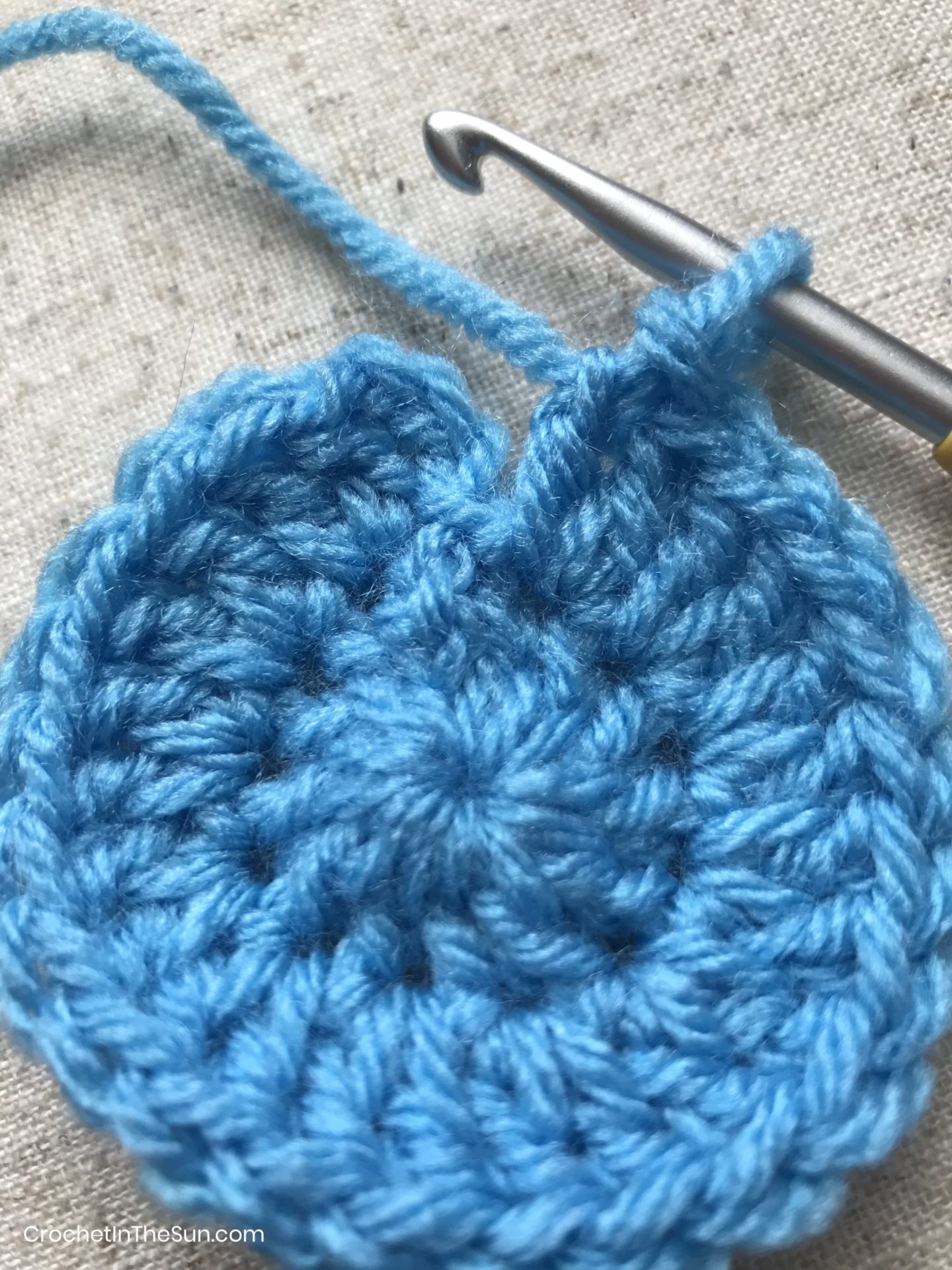 To complete this round of the circle, slip stitch to beginning chain. #crochet #crochetinthesun #howtocrochet #crochettutorial #crochetforbeginners
