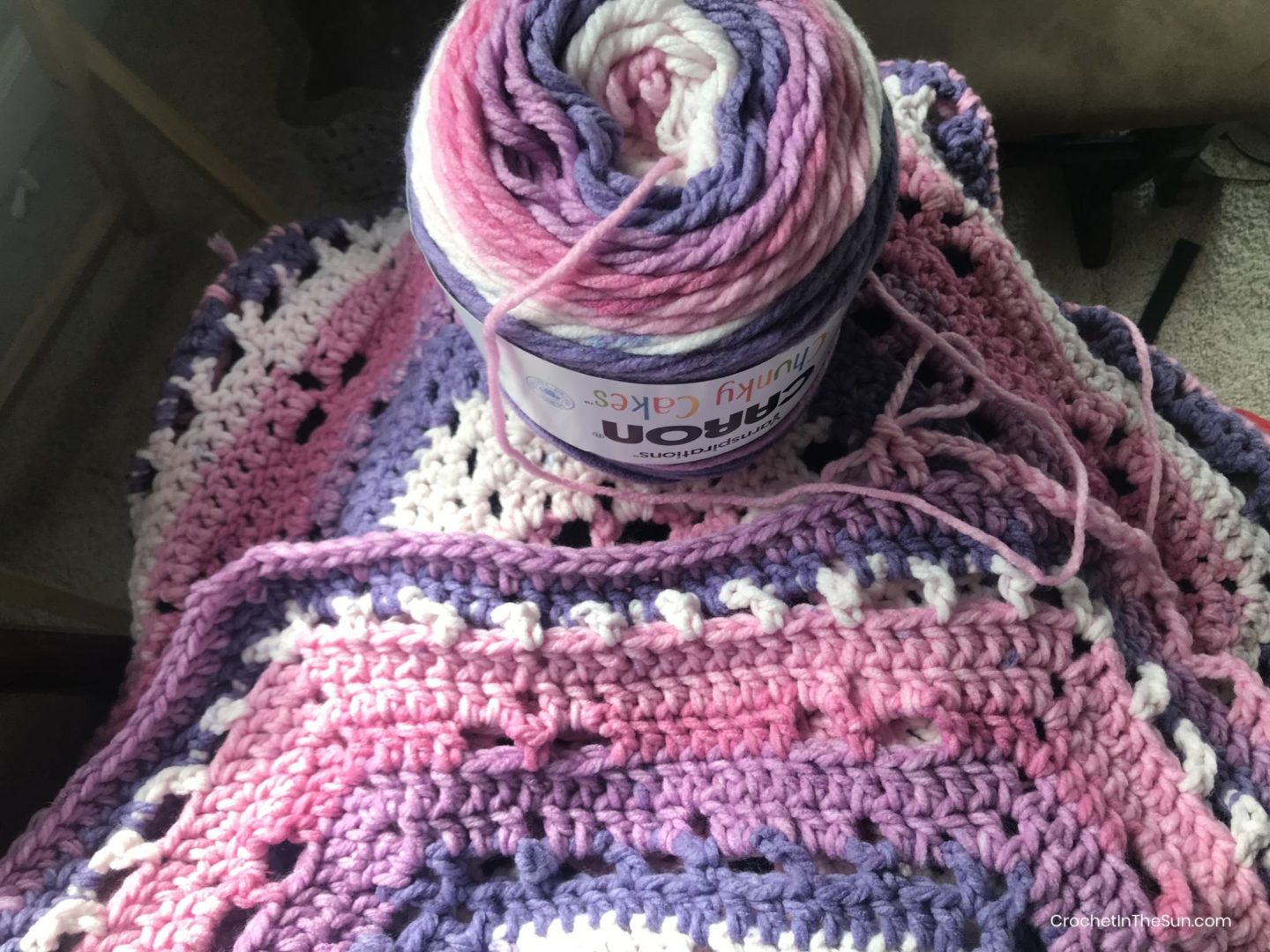 Caron Chunky Cakes in Ballet Sorbet is used for this free crochet blanket pattern #crochet #crochetblanket #crochetinthesun