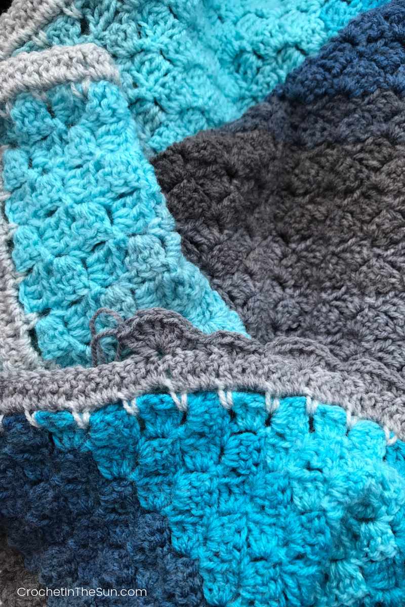 Adding a shell border to a C2C blanket. Learn how to Corner to Corner crochet with this free pattern and tutorial.  #crochet #C2C #crochetblanket #c2ccrochet