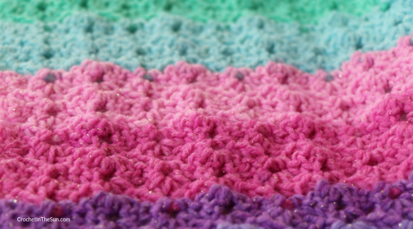 This GORGEOUS blanket uses Lion Brand Mandala Sparkle. Here is close up of the stitches #crochet #crochetblanket #howtocrochet #crochetinthesun