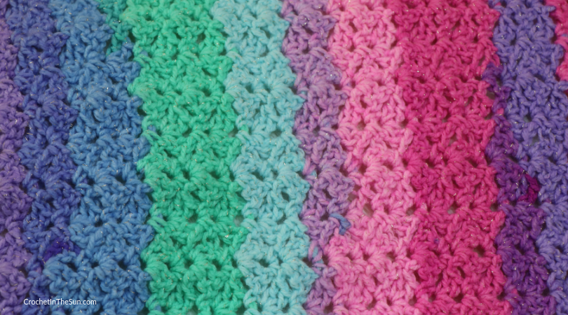 This pretty blanket uses Lion Brand Mandala Sparkle. Here is close up of the stitches #crochet #crochetblanket #howtocrochet #crochetinthesun