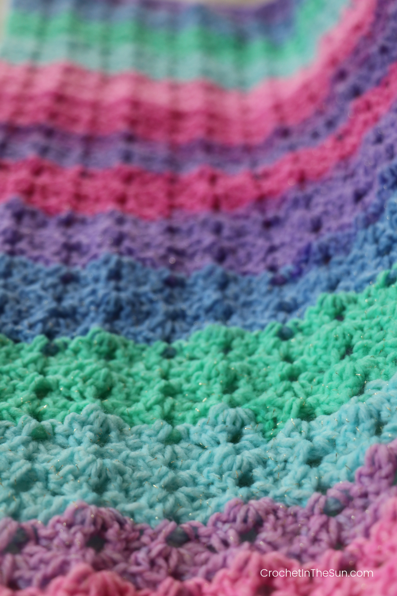 This self-striping yarn has such a gorgeous design. This is Lion Brand Mandala Sparkle. #crochet #crochetblanket #howtocrochet #crochetinthesun