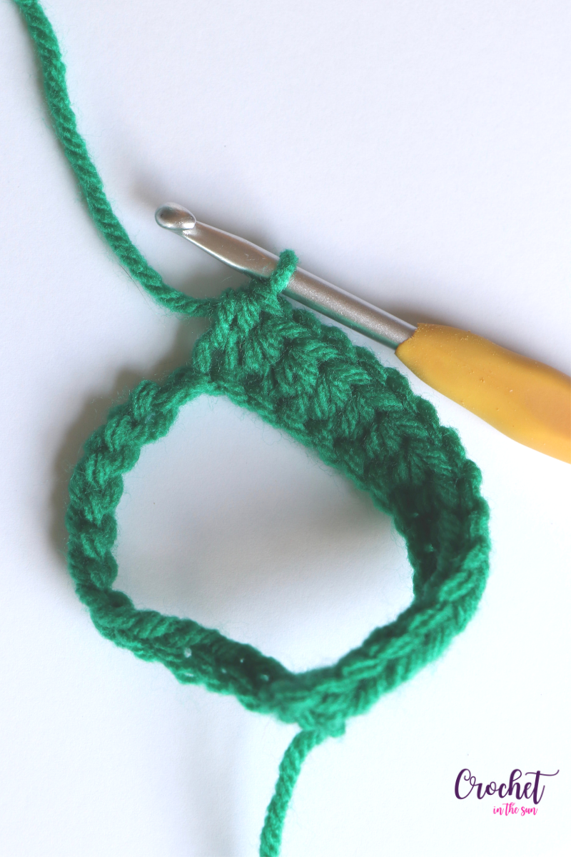 Free crochet pattern. Quick and easy 30 minute Cup Cozy. Row 1: HDC in every chain. See the blog for full directions #crochet #crochettutorial #crochetinthesun
