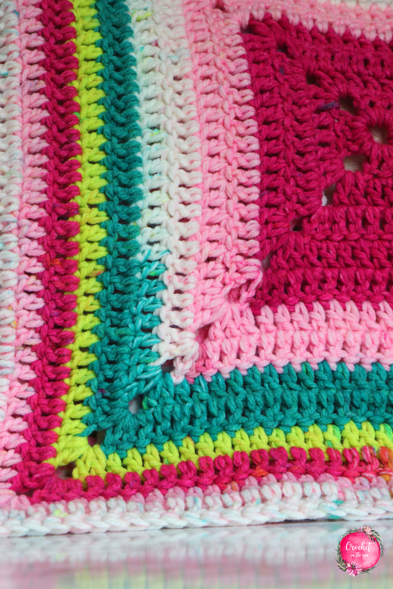 Details of the Lion Brand Whitby Crochet Baby Blanket pattern. This free crochet pattern is easy and a great project for beginners due to the repetitive pattern and super bulky yarn. #crochetblanket #crochet