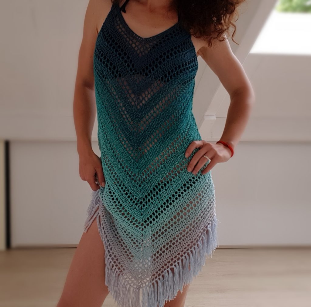 What to make with Scheepjes Whirl yarn? Here are 7 dieas! The colors in this crochet beach cover are gorgeous. This was made using Scheepjes Whirl, and think it was the perfect color choice! #crochet #crochetforbeginners #selfstripingyarn