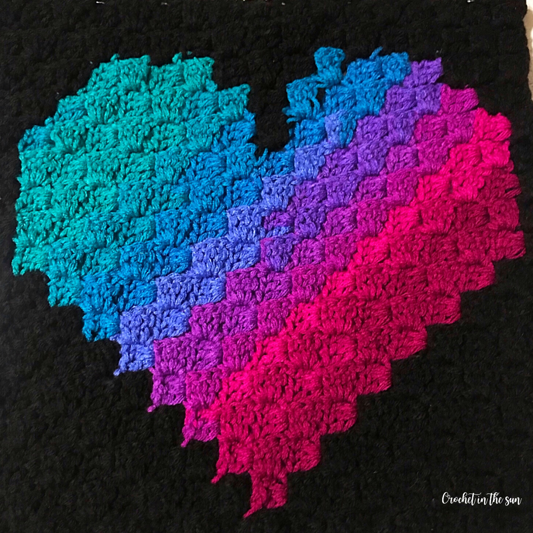 Free corner to corner crochet heart pattern. This design is super colorful and fun, great crochet project for beginners learning to C2C!
