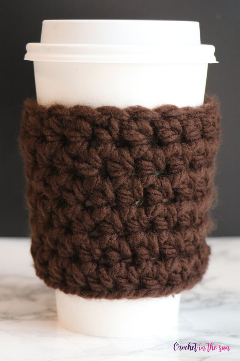 Free crochet cup cozy pattern. Chunky crochet cup cozy that takes 30 minutes to make! #freecrochetpattern #crochet #howtocrochet