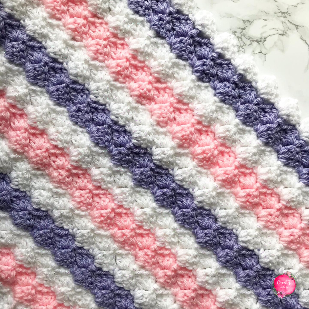 Corner to corner striped blanket, full with colors for spring!. This blanket is beginner friendly, as it includes a C2C chart. Full of beautiful colors, give it a try! #crochetblanket #crochetforbeginners