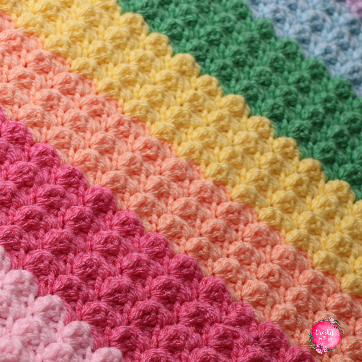 FREE Rainbow crochet blanket pattern that is easy, quick to work up, and beginner friendly. This includes a photo tutorial. Make your own crocheted rainbow blanket!!