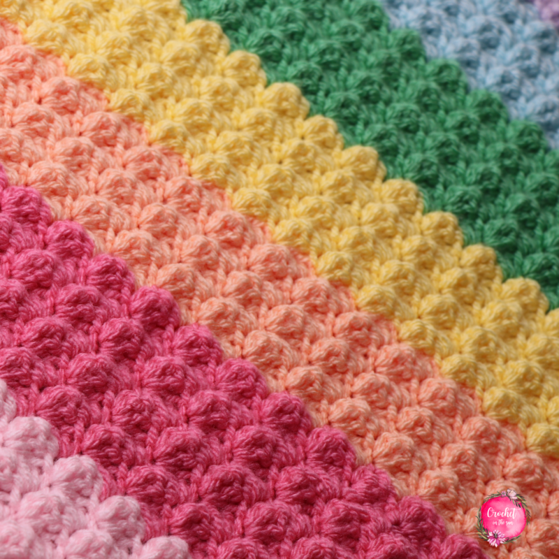 Rainbow crochet blanket pattern that is free, easy, and beginner friendly