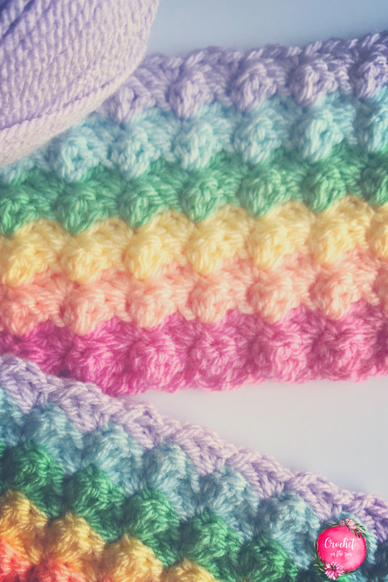 This beautiful and bright crochet blanket is easy to make and beginner friendly. Use your favorite colors for this rainbow crochet blanket pattern!