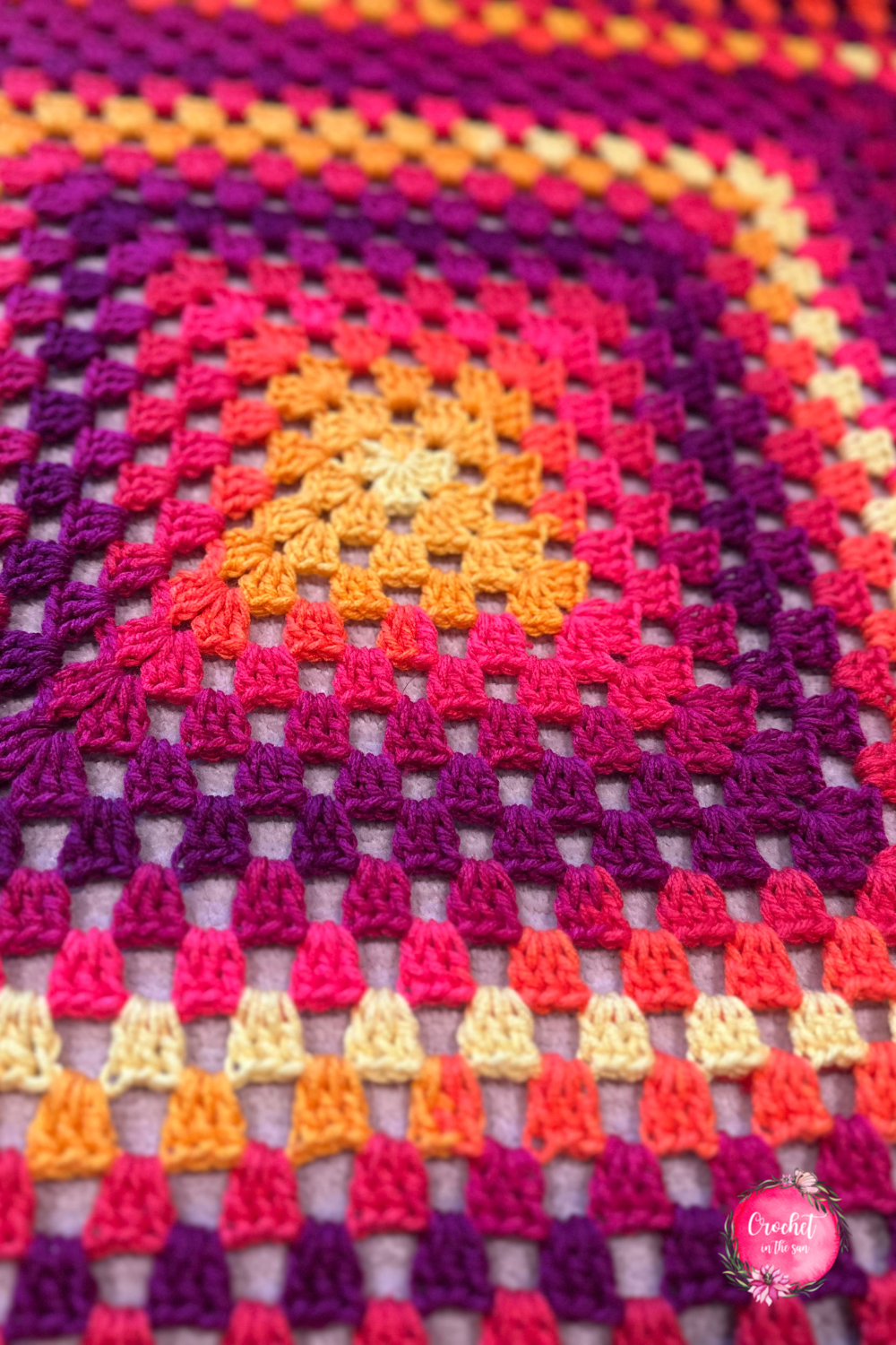 Close up of granny square blanket pattern using Red Heart self-striping yarn. Crochet pattern is free and easy, step by step photo tutorial included