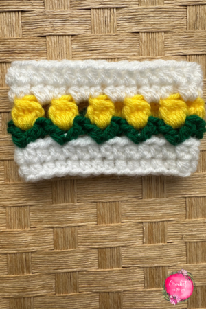 Crochet tulip cup cozy featuring the crochet puff stitch! The puff stitch adds the perfect soft texture to this cup cozy! Beginner-friendly and easy to learn
