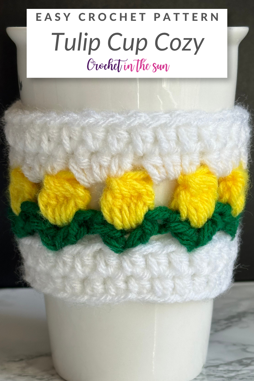 Free crochet pattern - Tulip Cup Cozy. See the blog for the FREE pattern and photo tutorial. This is a beginner-friendly 30 minute crochet project. #crochet #crochettutorial #crochetinthesun